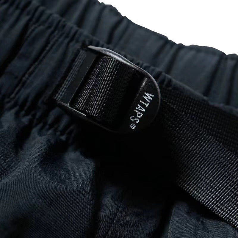 WTAPS imperméable en nylon poche zippée respirant cheville-binding