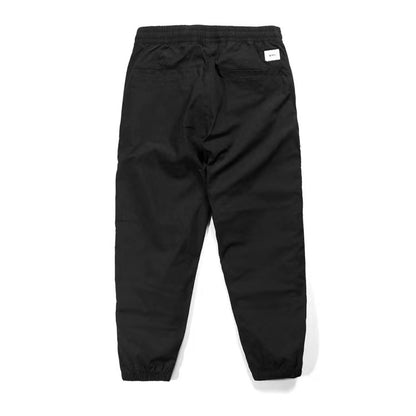 WTAPS pantalon en nylon de style décontracté décoré à fermeture à glissière latérale