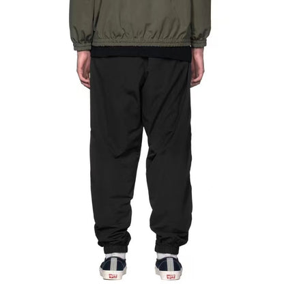 WTAPS pantalon en nylon de style décontracté décoré à fermeture à glissière latérale